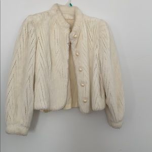 It’s a beautiful white rabbit fur coat.